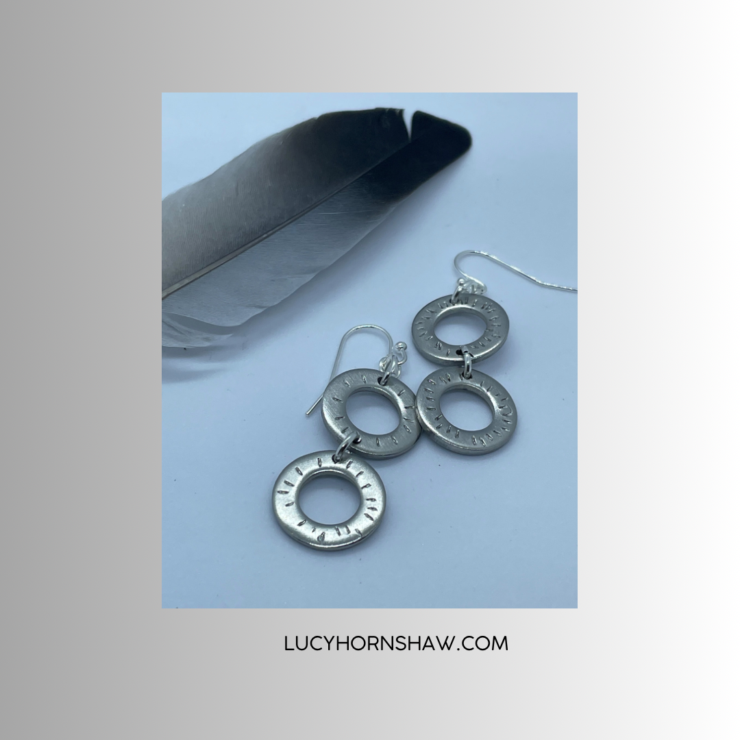 2 ring drop steel earrings.