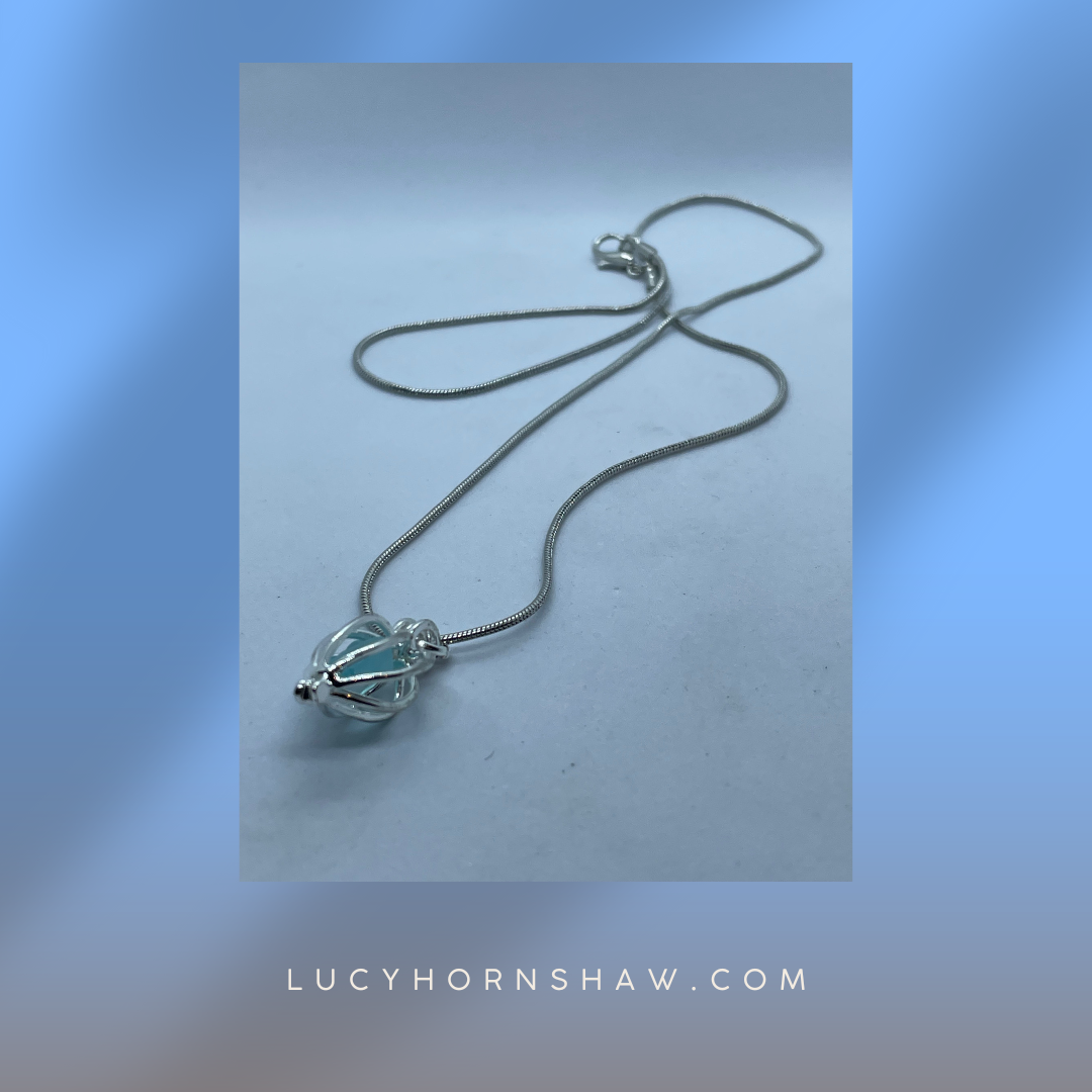Turquoise Seaglass in silver cage necklace