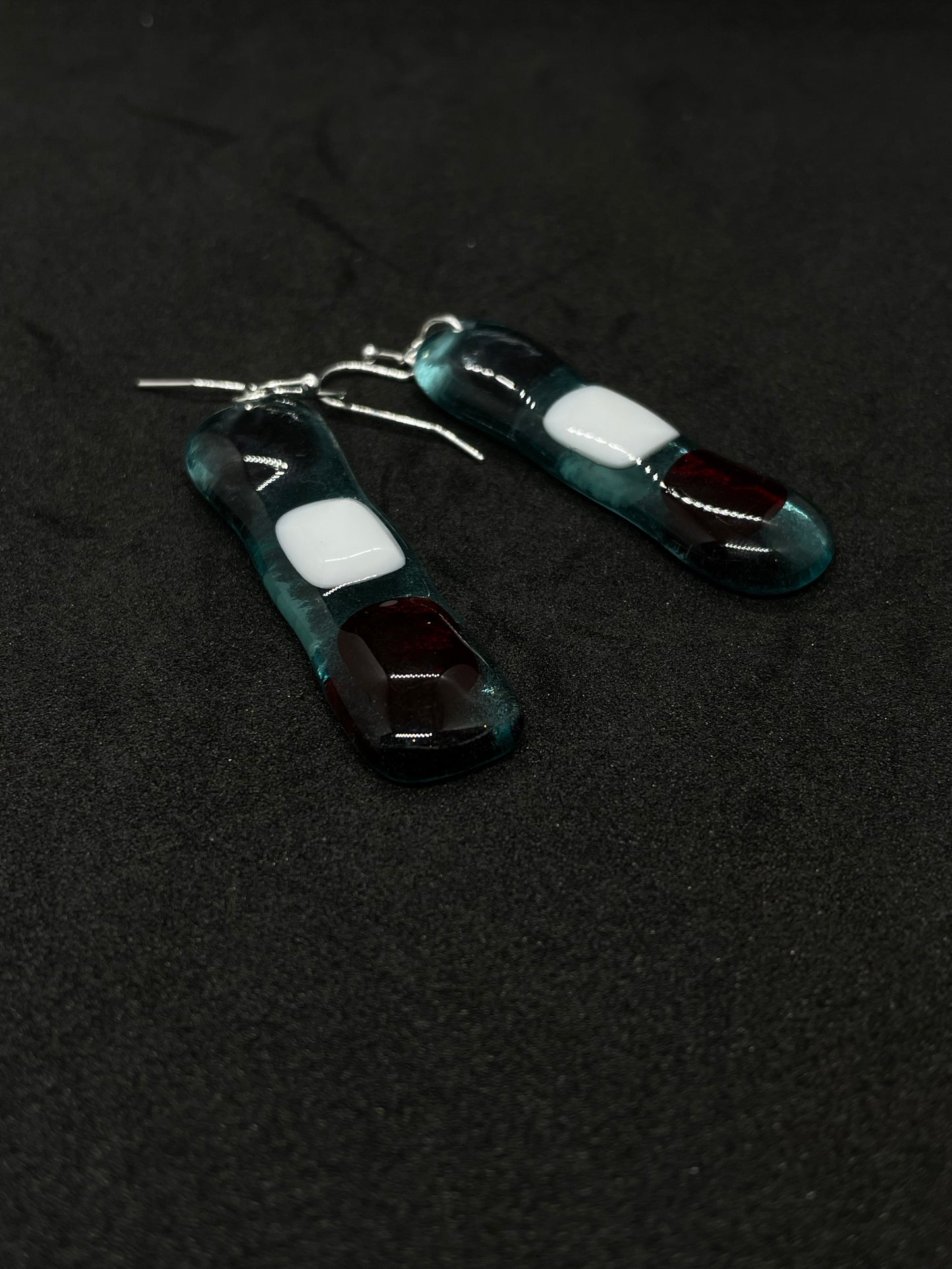Fused clear glass with red, blue, and white squares oblong earrings