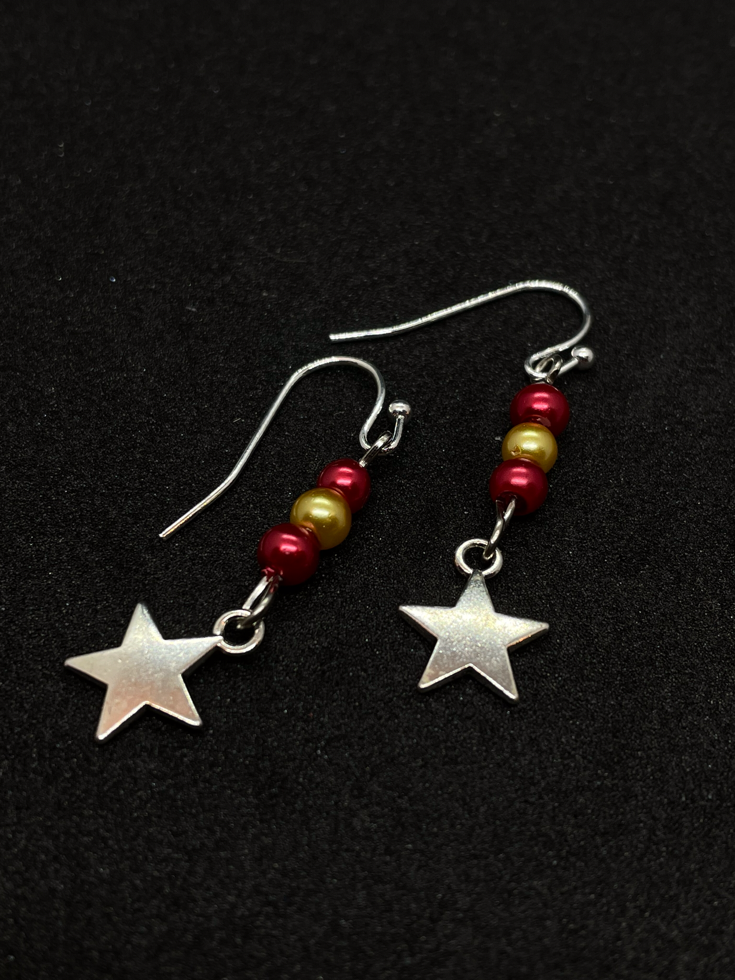 Festive drop earrings with beads and stars