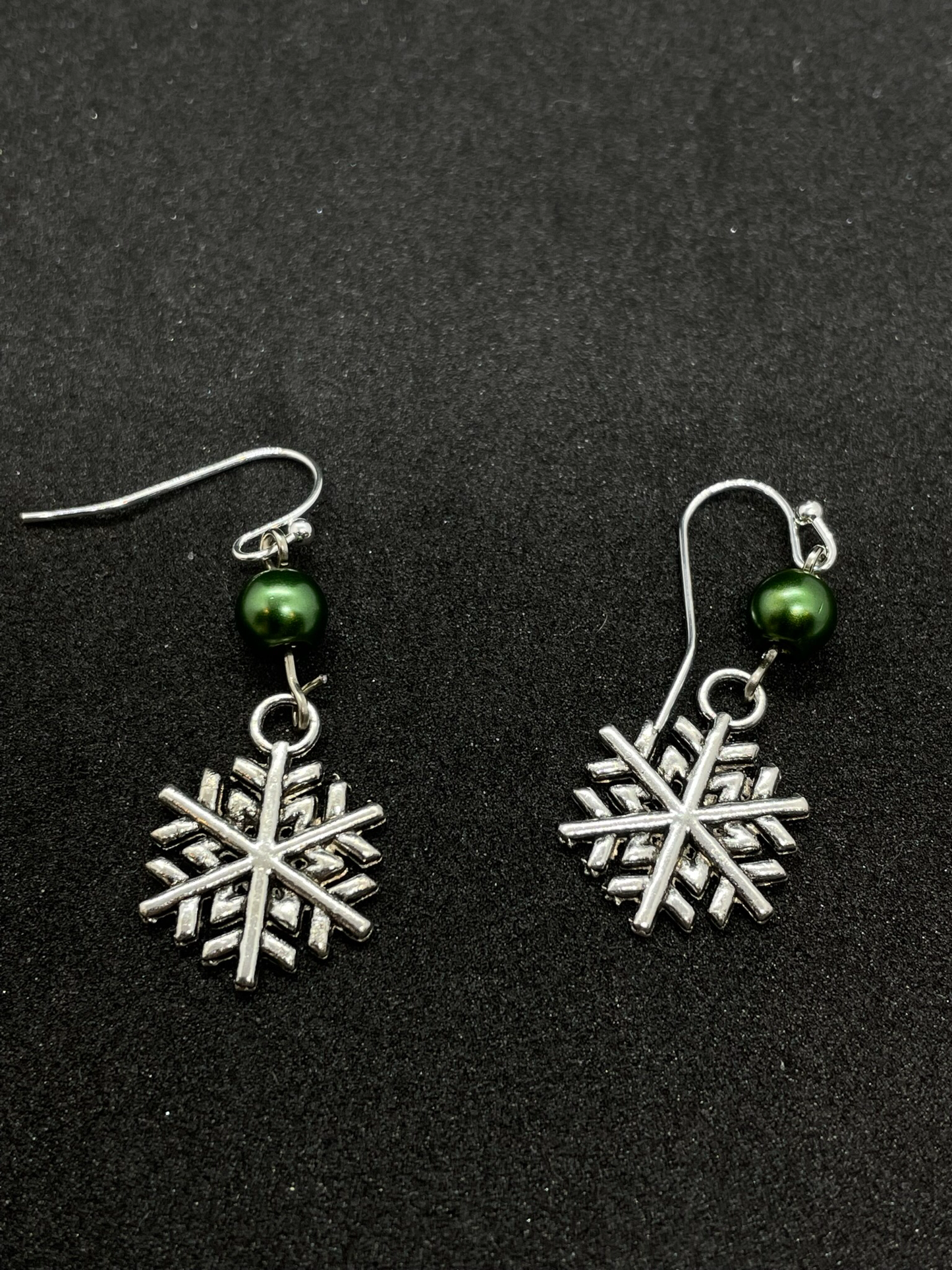 Festive snowflake dangling from bead, drop earrings