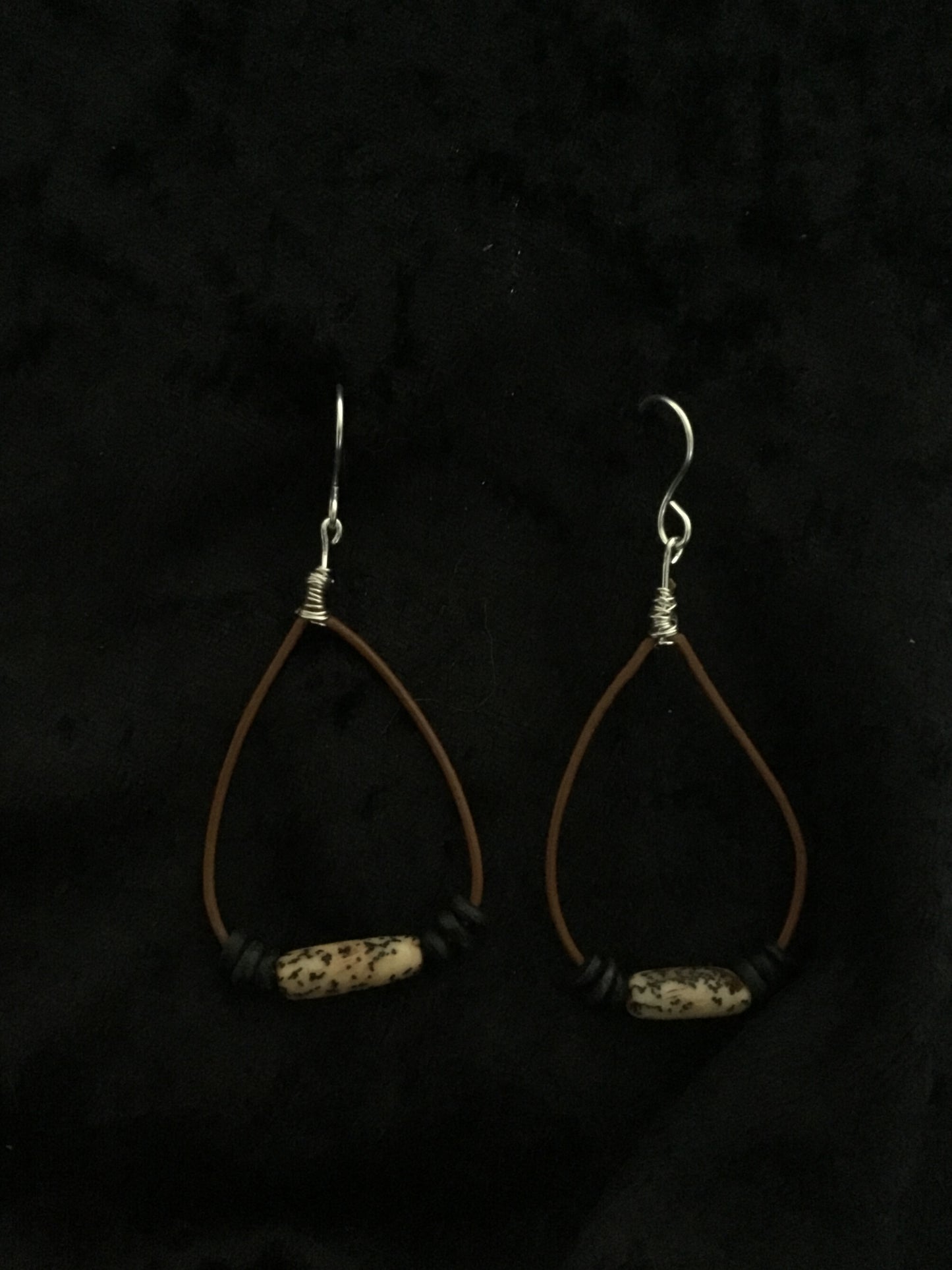 Blue bead on black leather cord earrings
