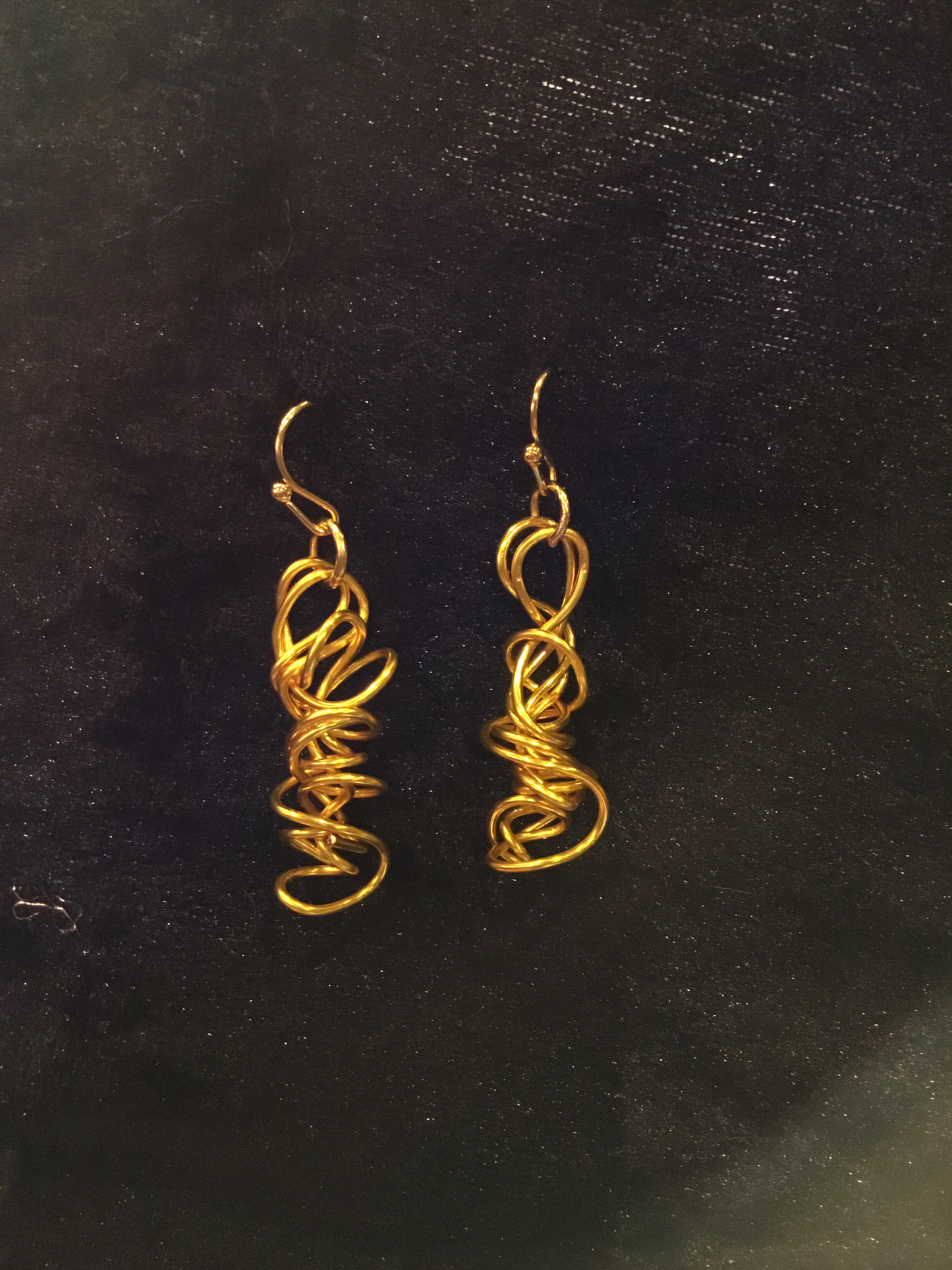 Wire tight twist earrings in gold wire