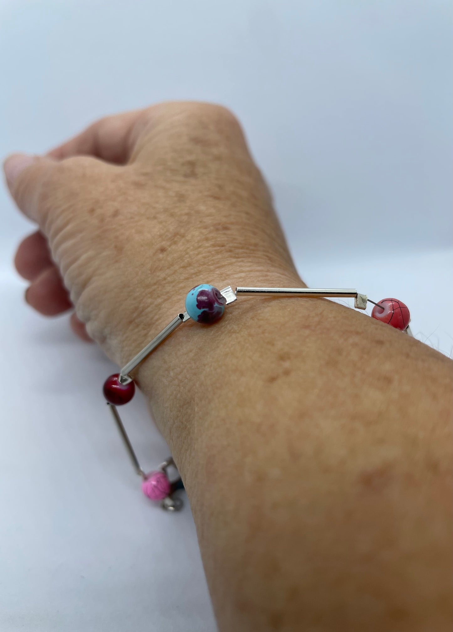 Wire & multi coloured bead bracelet - pink, blue orange