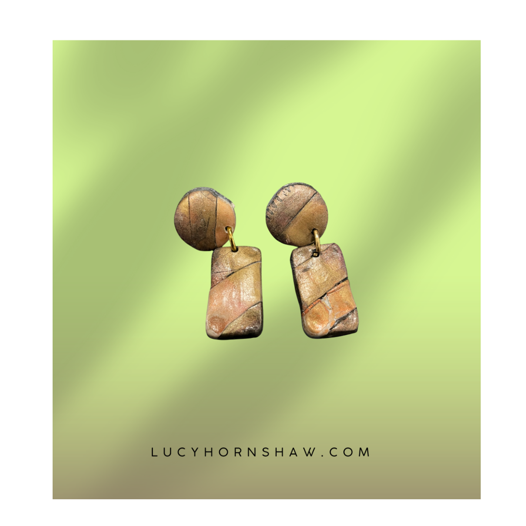 Brown & black metallic ink oblong on disc Polymer clay earrings