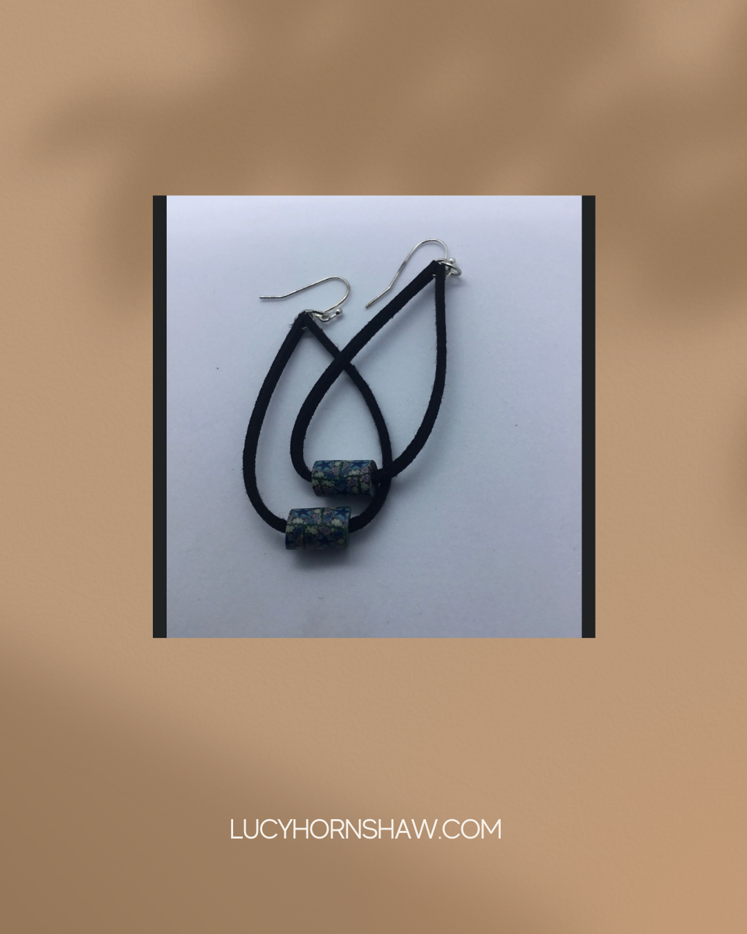 Blue bead on black leather cord earrings