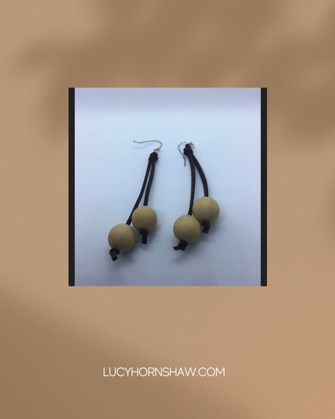 Wooden cream bead on brown leather thong earrings