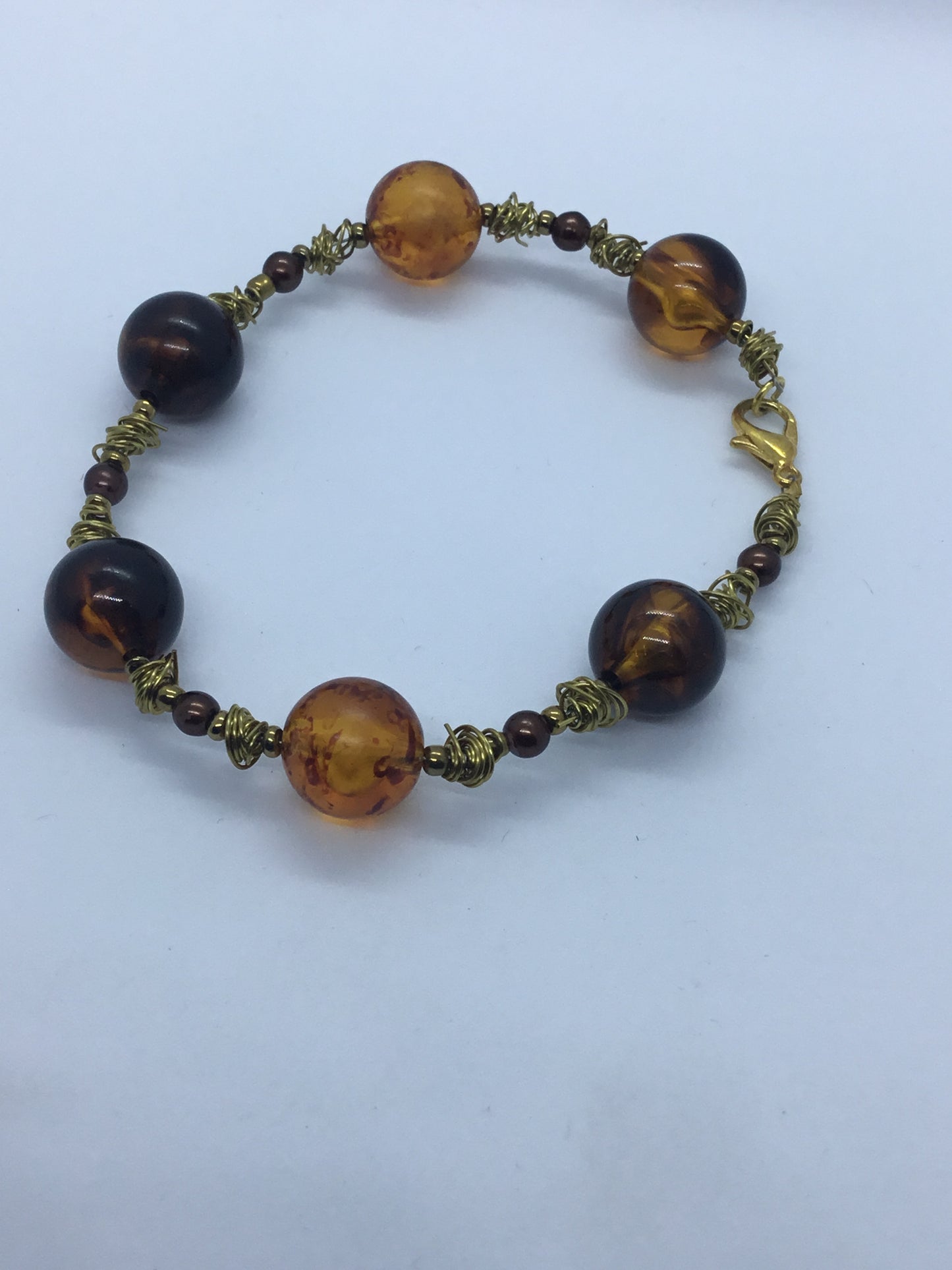 Wire & brown bead bracelet with gold wire