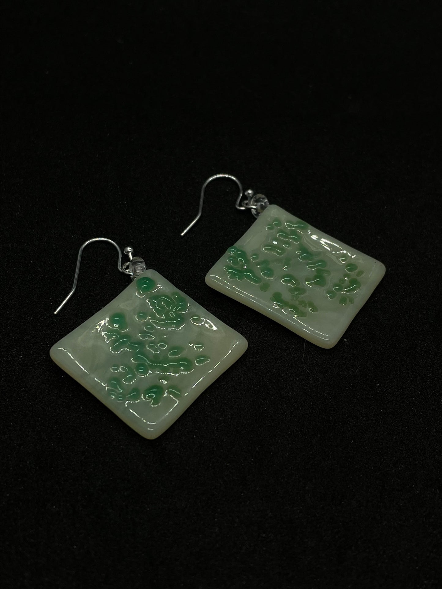 White and green rhombus fused glass earrings.