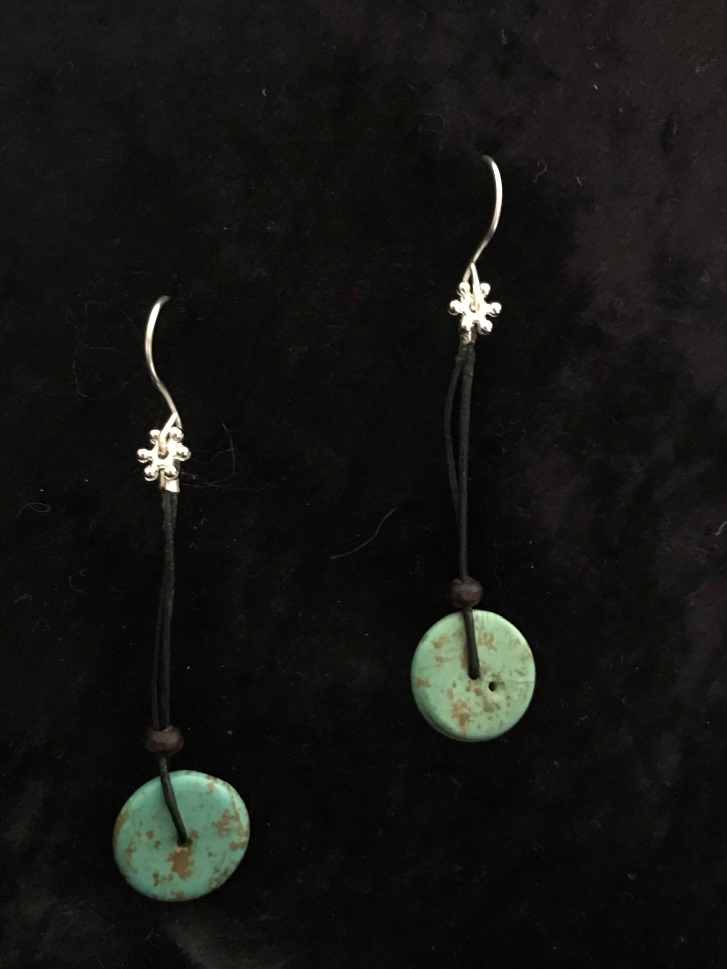 Turquoise bead on black leather cord earrings