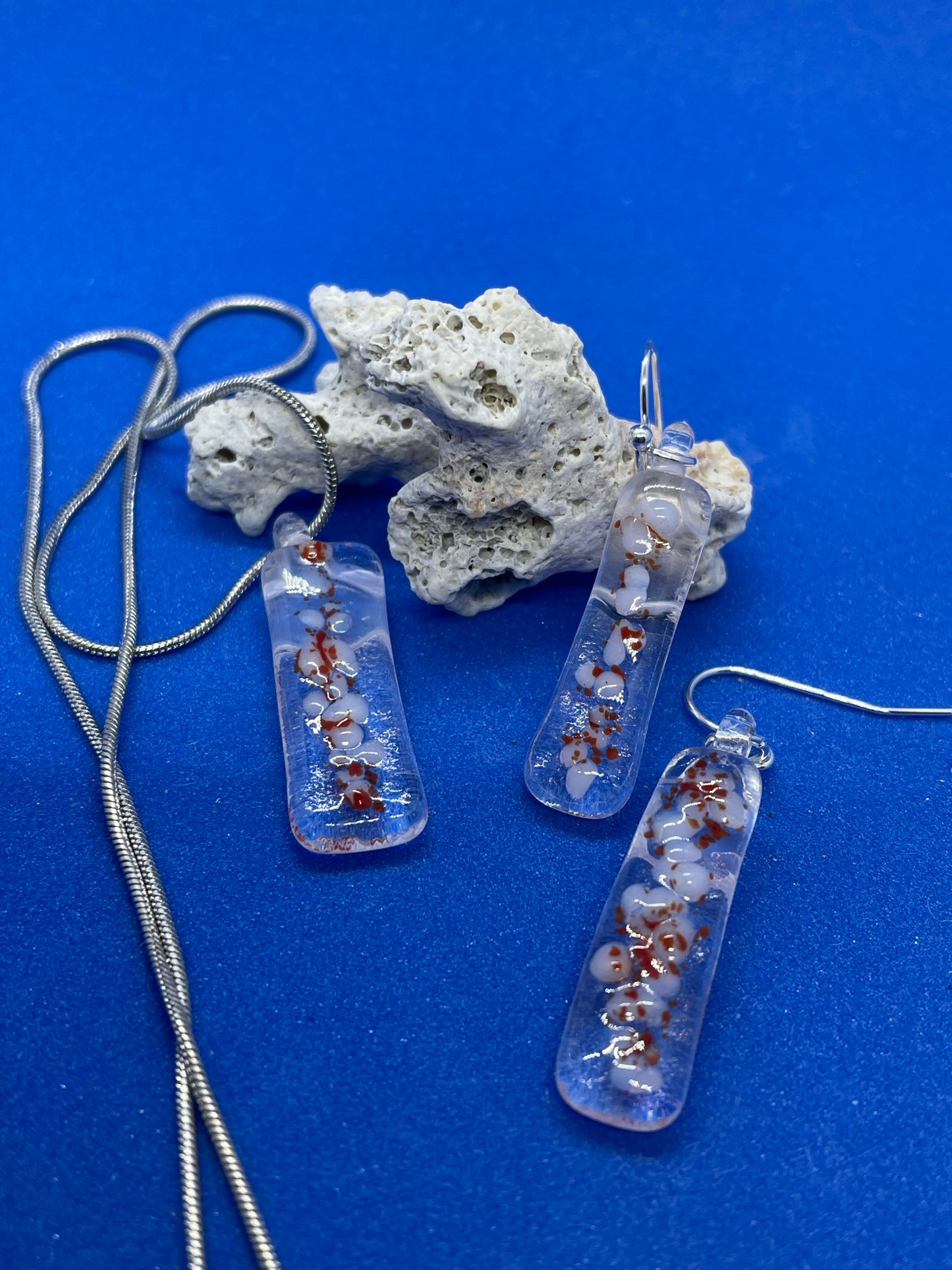 Fused clear, white and red glass oblong necklace
