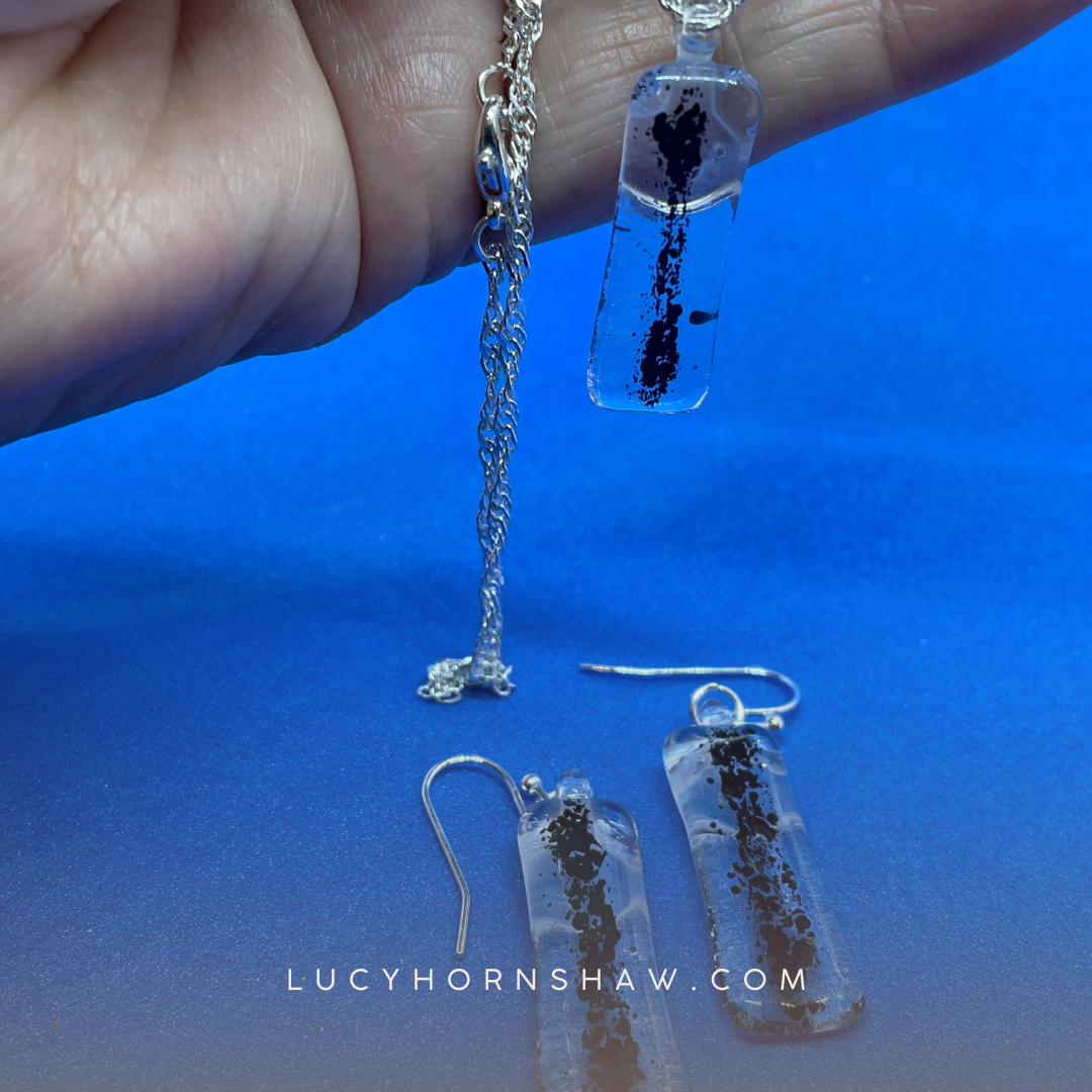 Fused clear and black glass oblong necklace