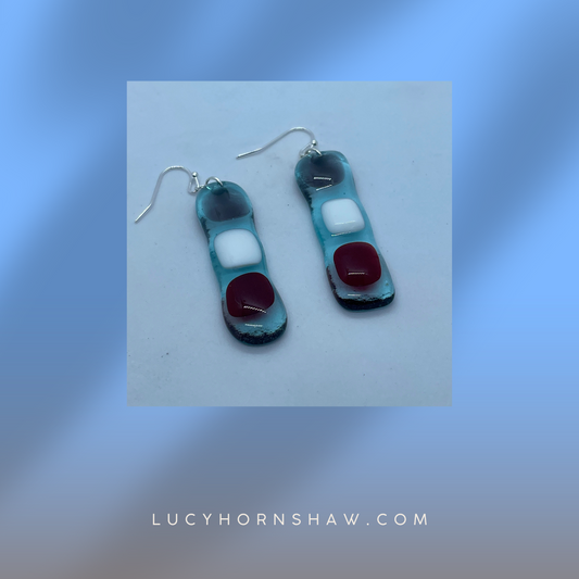Fused clear glass with red, blue, and white squares oblong earrings