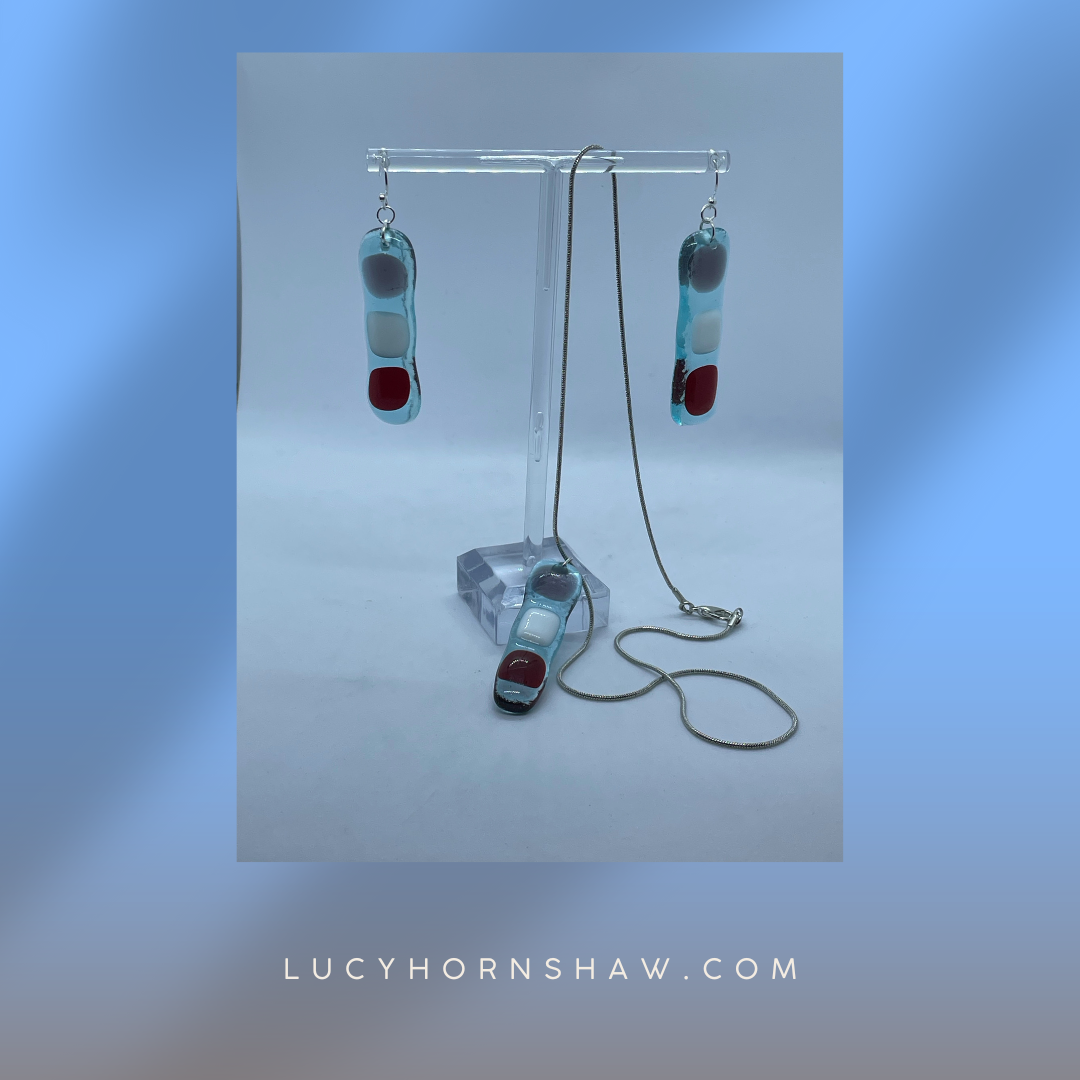 Fused clear glass with red, blue, and white squares oblong earrings