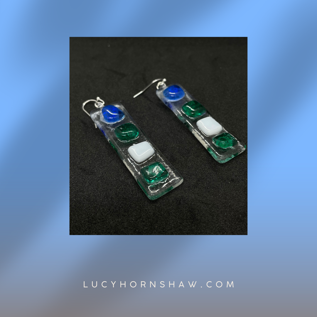 Fused clear glass with blue, green, and white squares oblong necklace