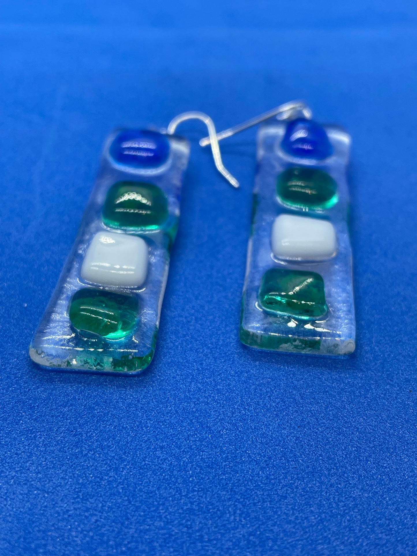 Fused clear glass with blue, green, and white squares oblong earrings