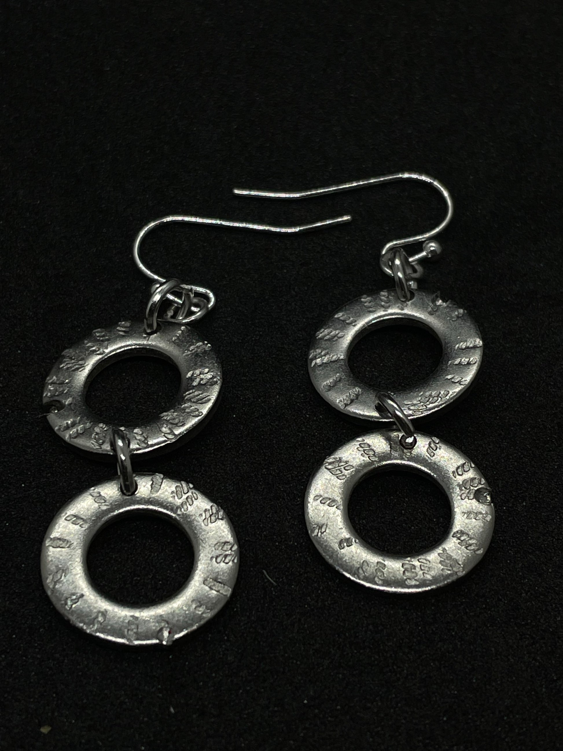 2 ring drop steel earrings.