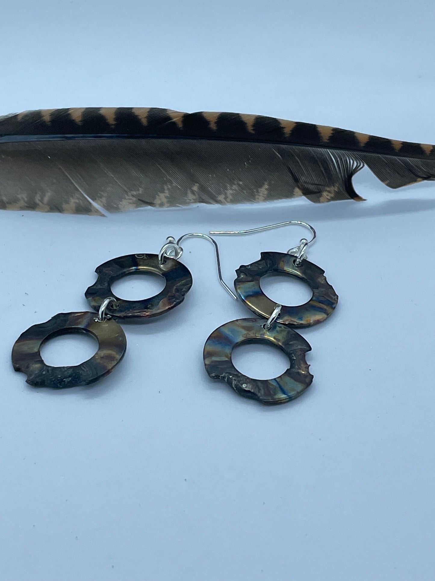 2 ring annealed steel drop earrings.