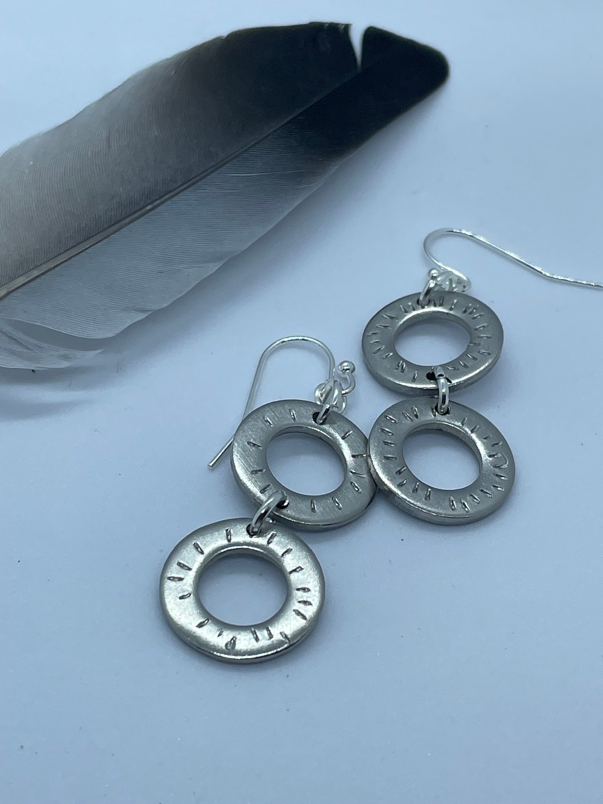 2 ring drop steel earrings.