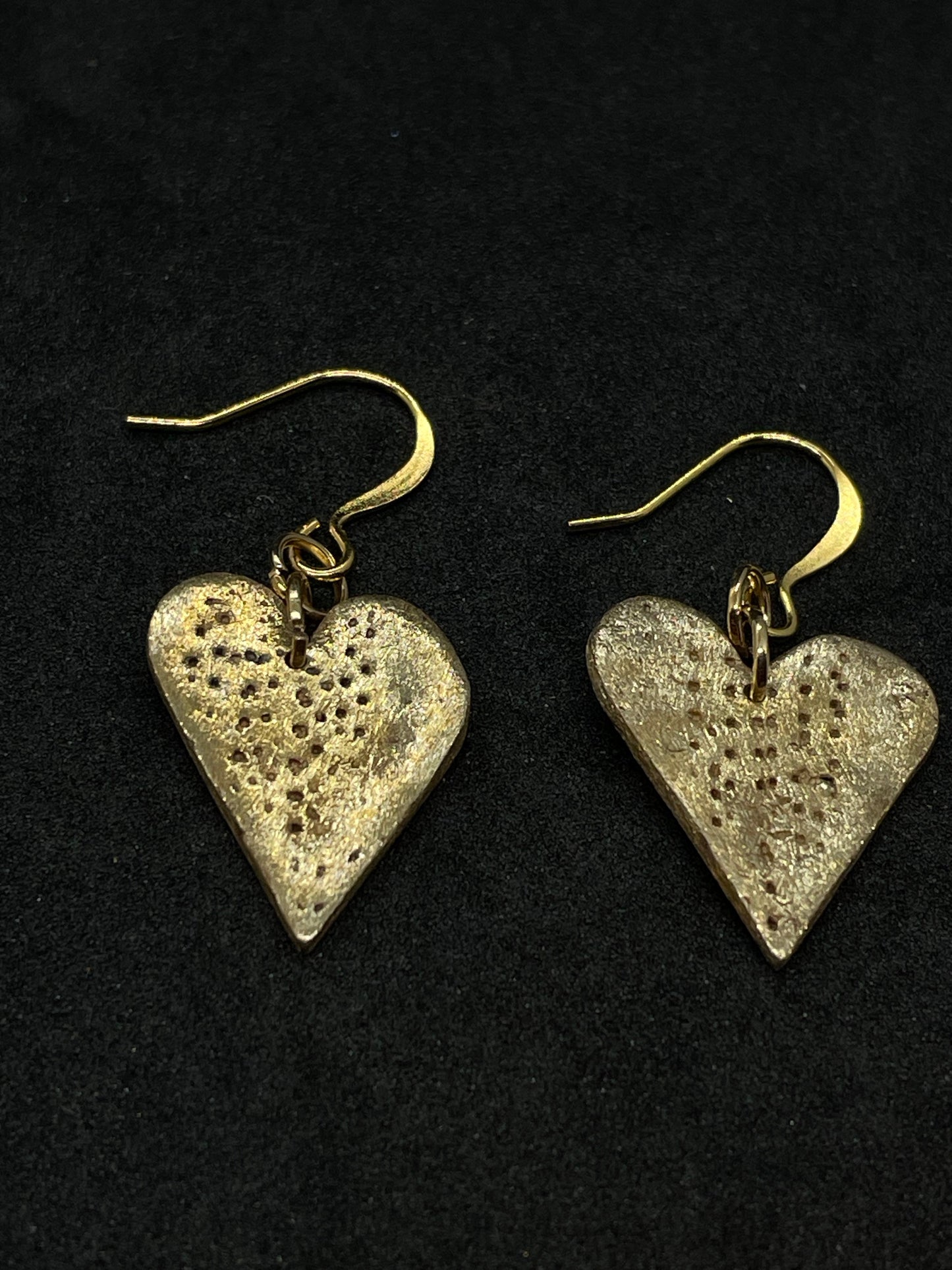 Bronze heart earrings with pin prick lines