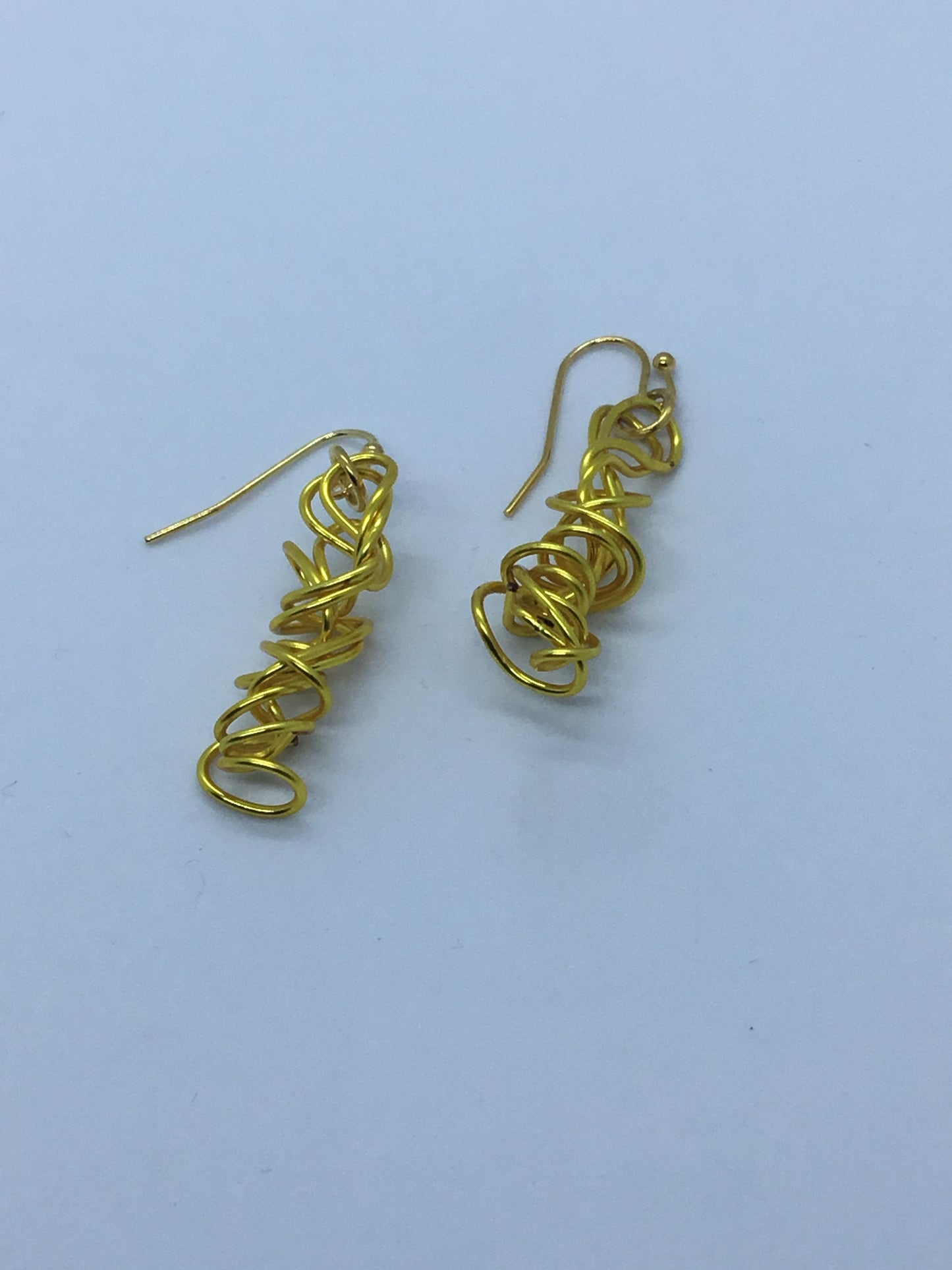 Wire tight twist earrings in gold wire