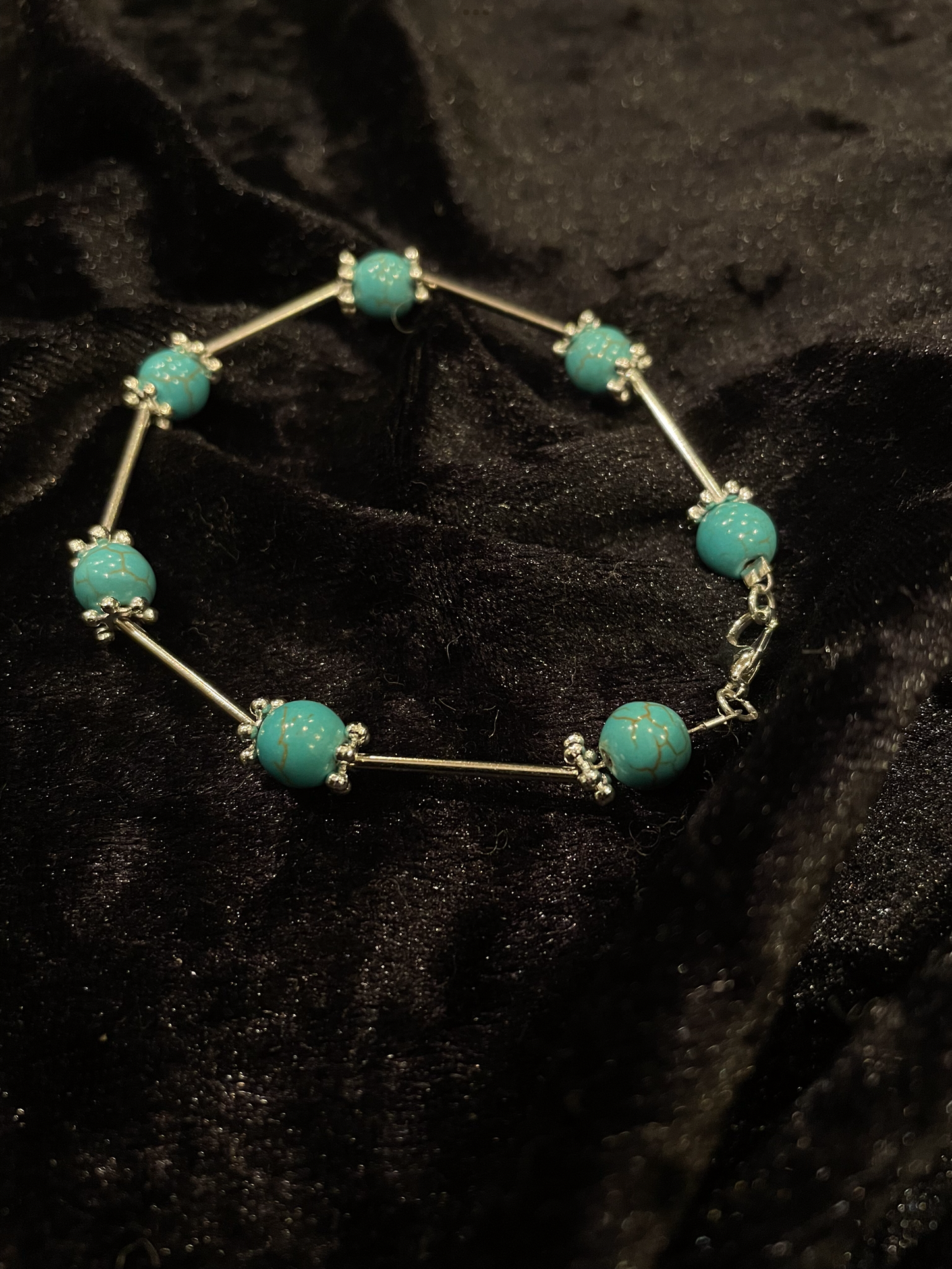 Wire & turquoise bead bracelet with silver rod spacers