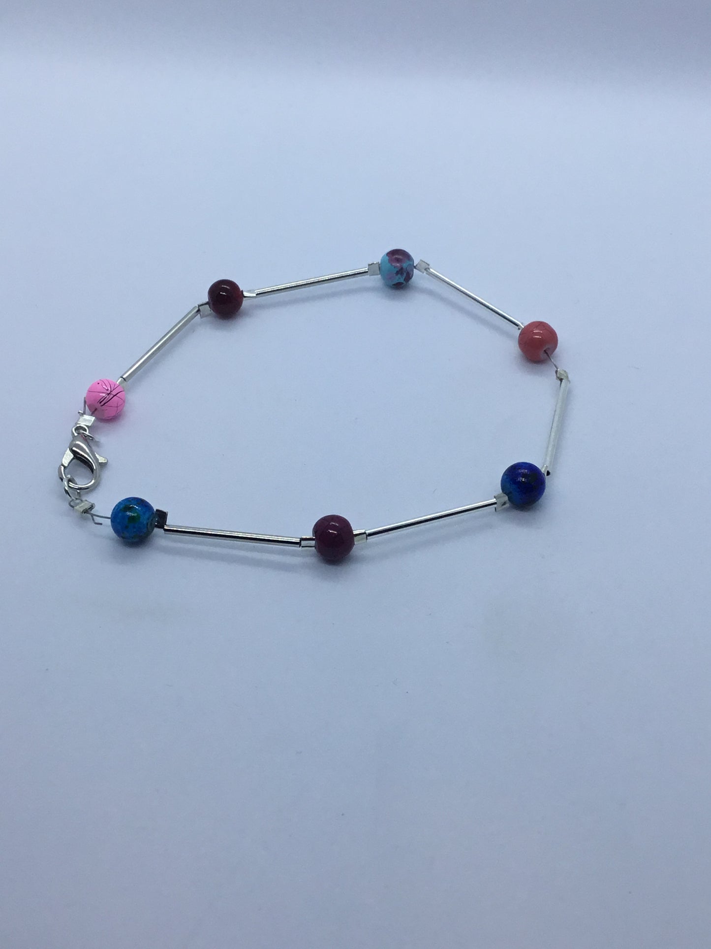 Wire & multi coloured bead bracelet - pink, blue orange