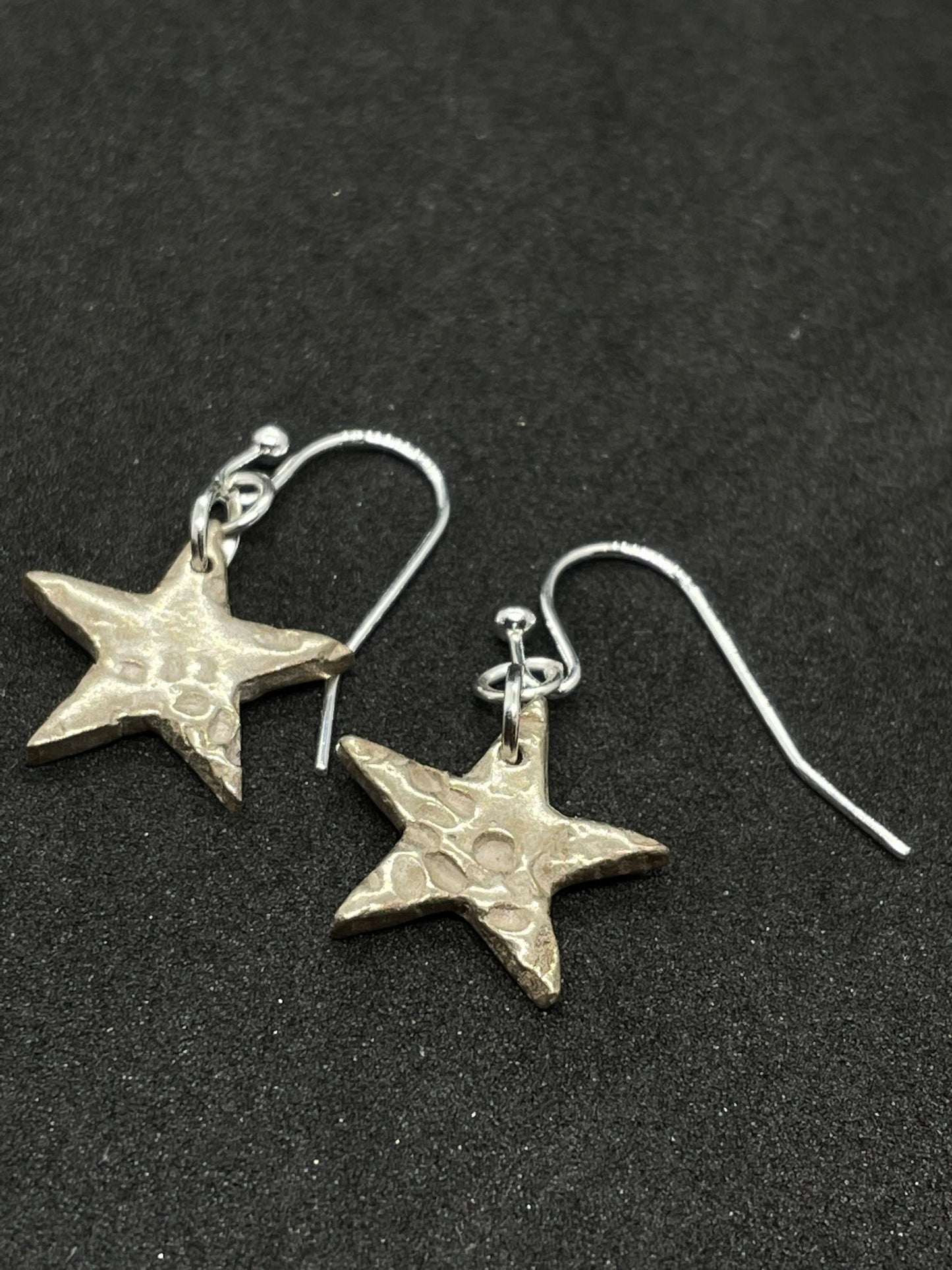 Bronze star earrings (silver affect)