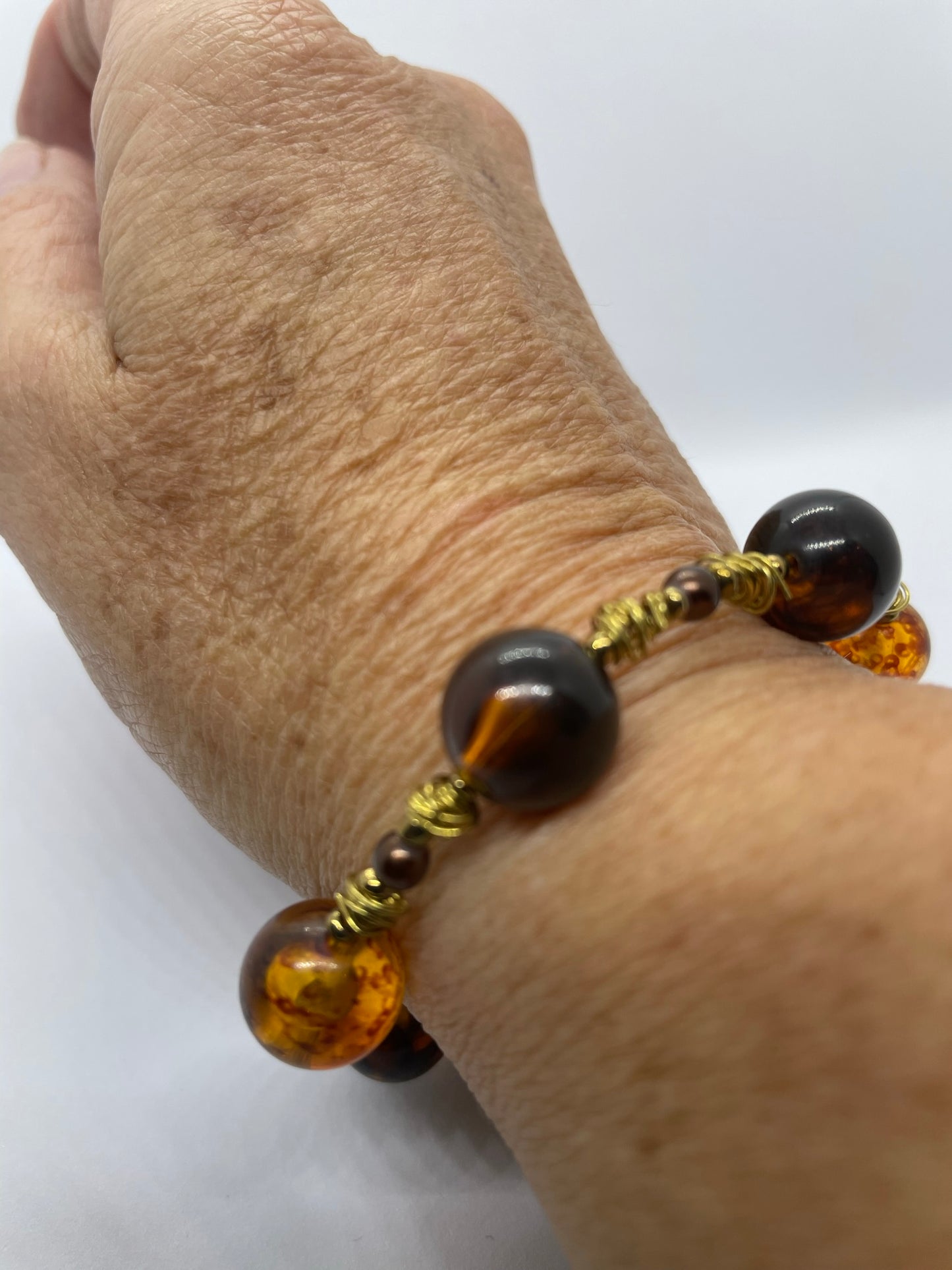 Wire & brown bead bracelet with gold wire
