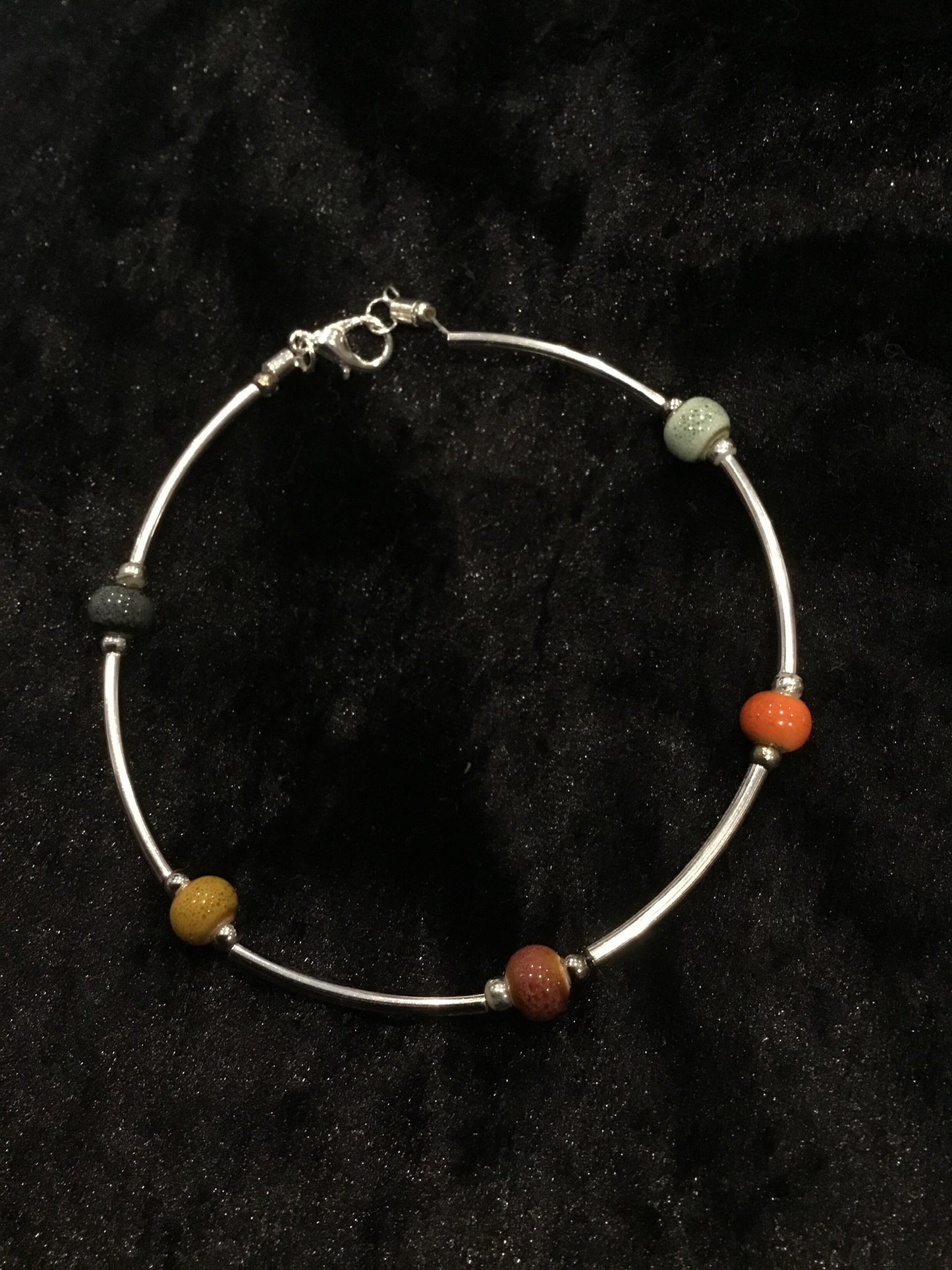 Wire & multi coloured bead bracelet
