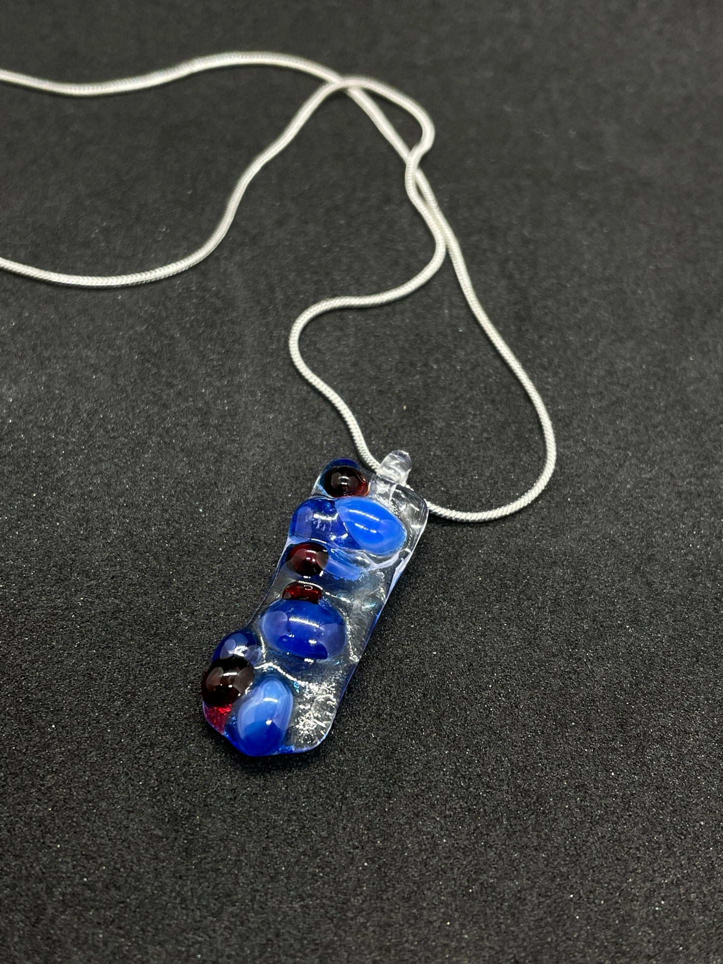 Fused clear and blue glass oblong necklace