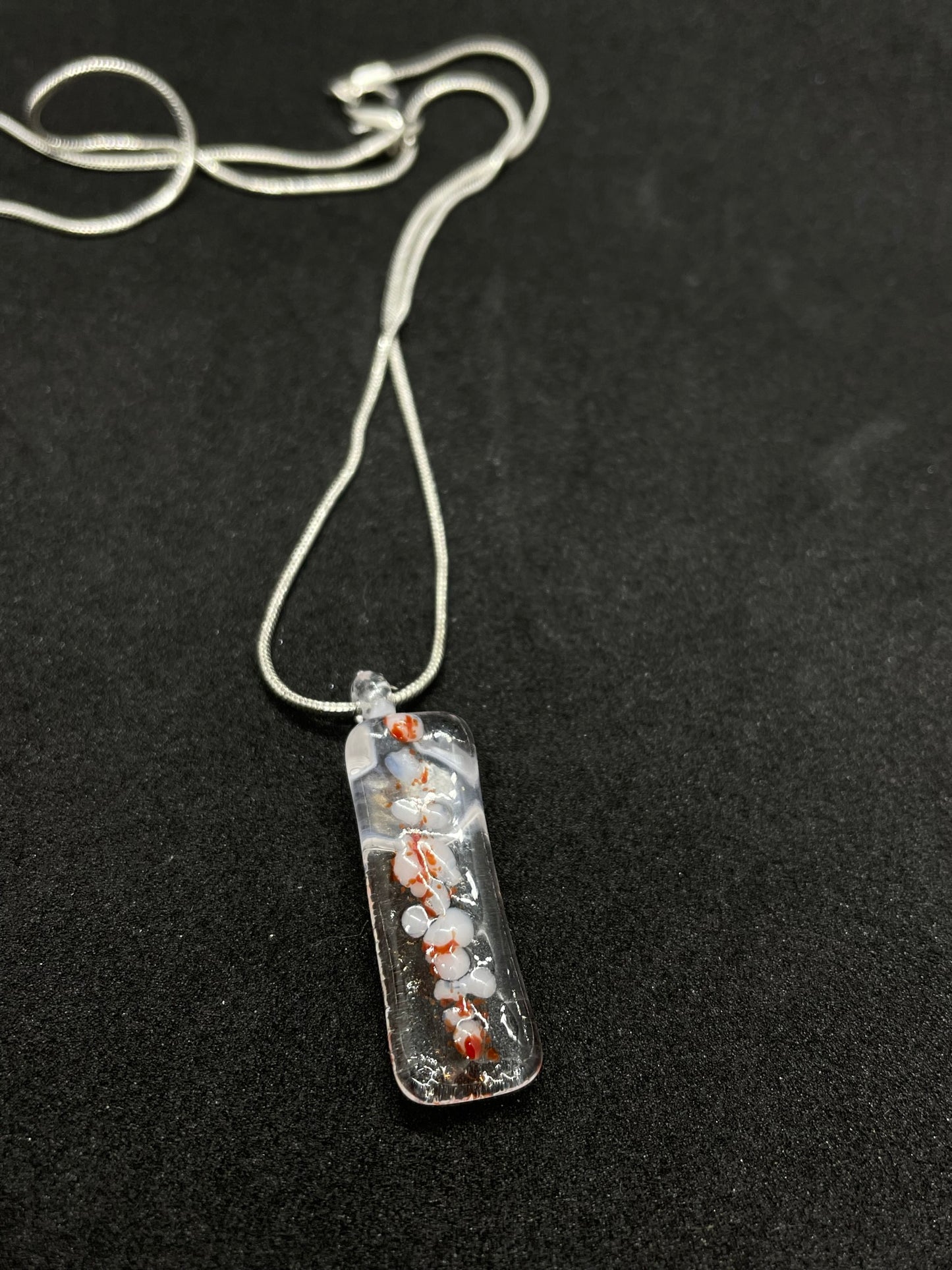 Fused clear, white and red glass oblong necklace