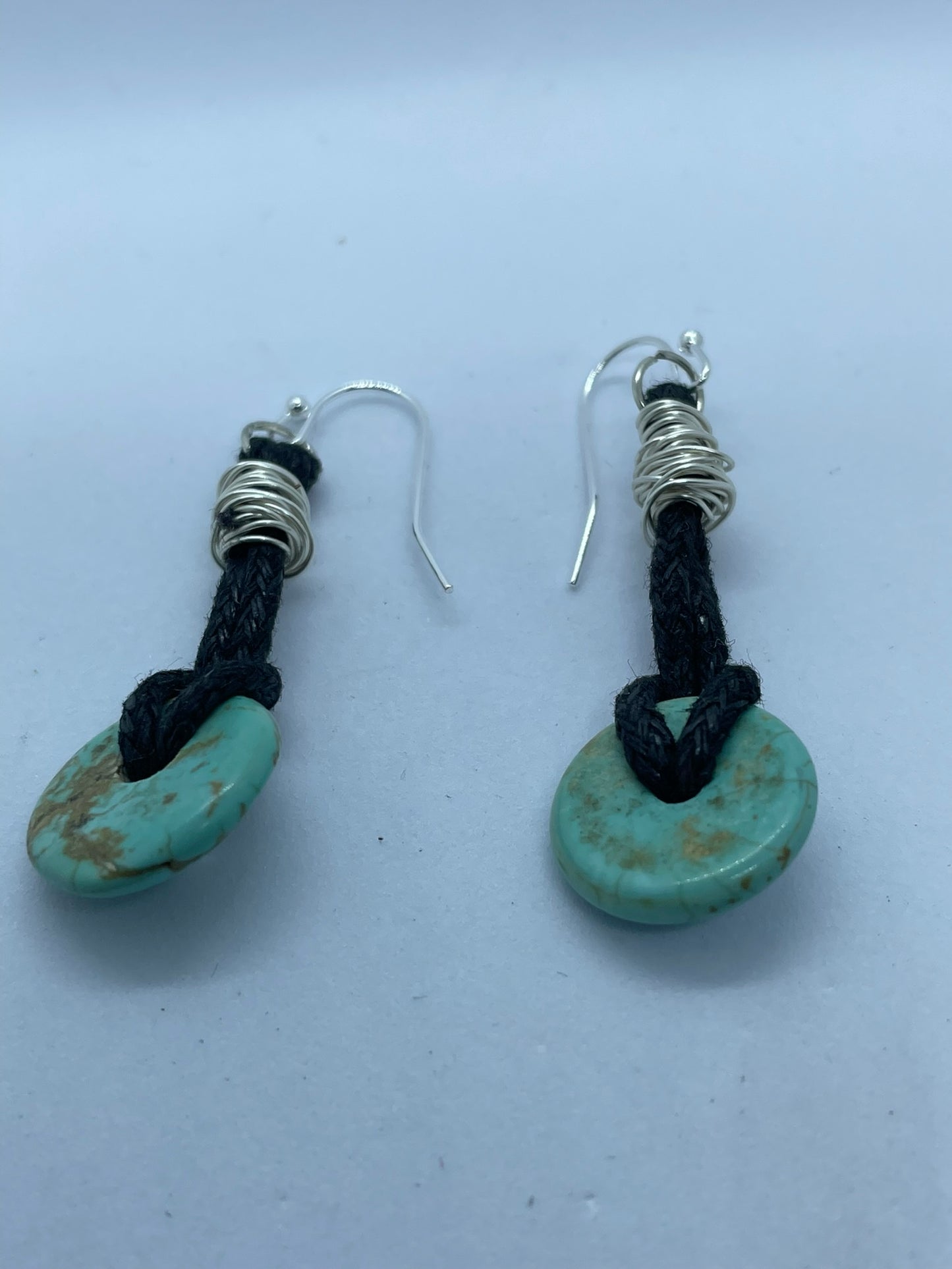 Black leather thong earrings with turquoise bead