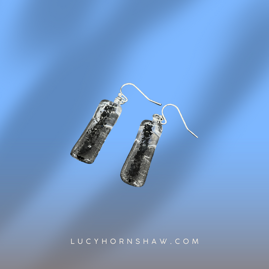 Fused clear and black glass oblong earrings