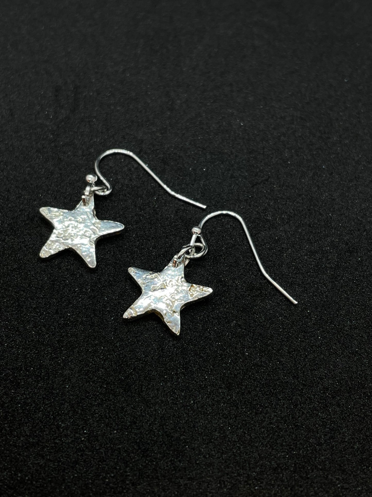Small silver star earrings