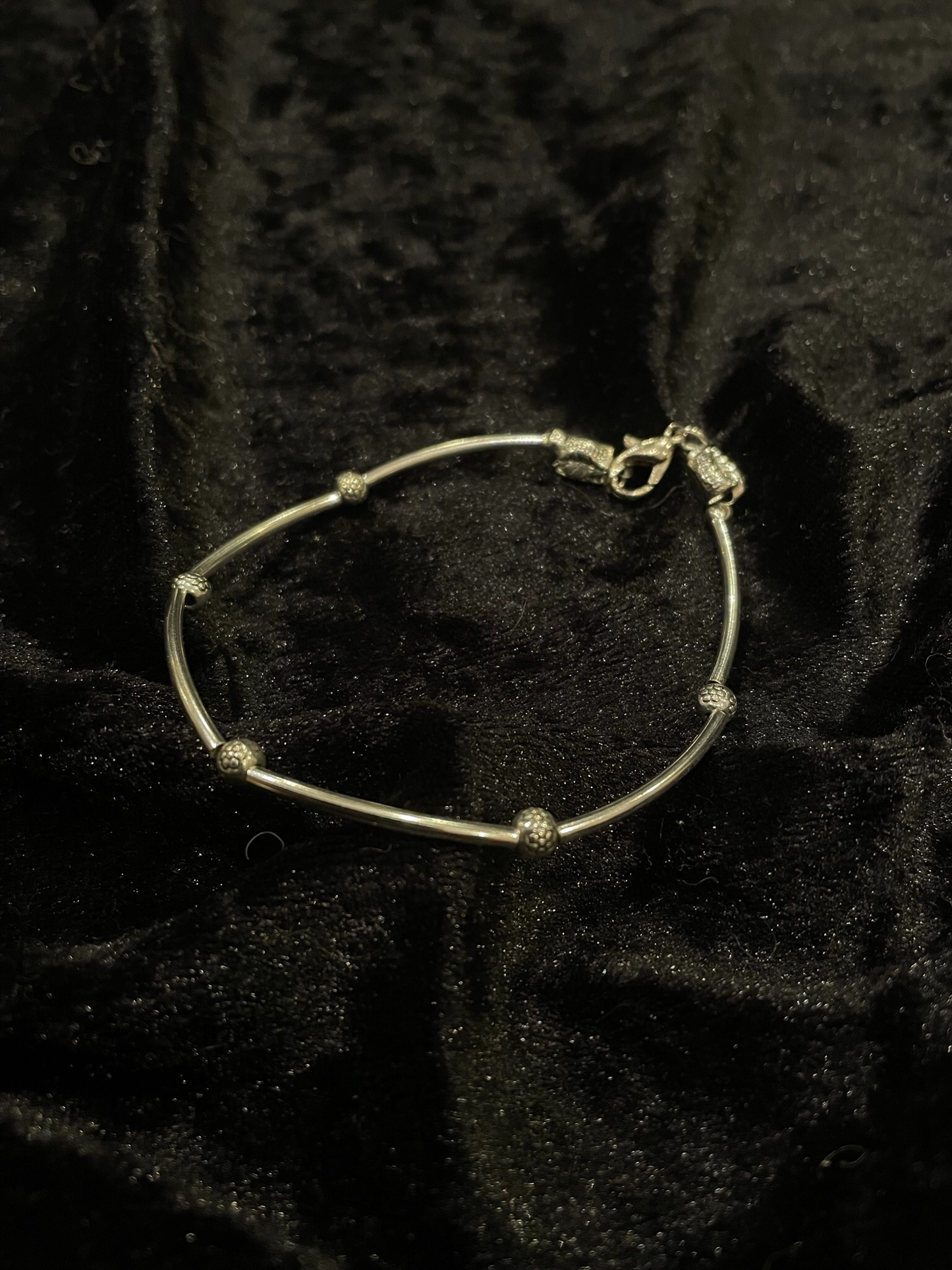 Wire & grey bead bracelet with silver rod spacers