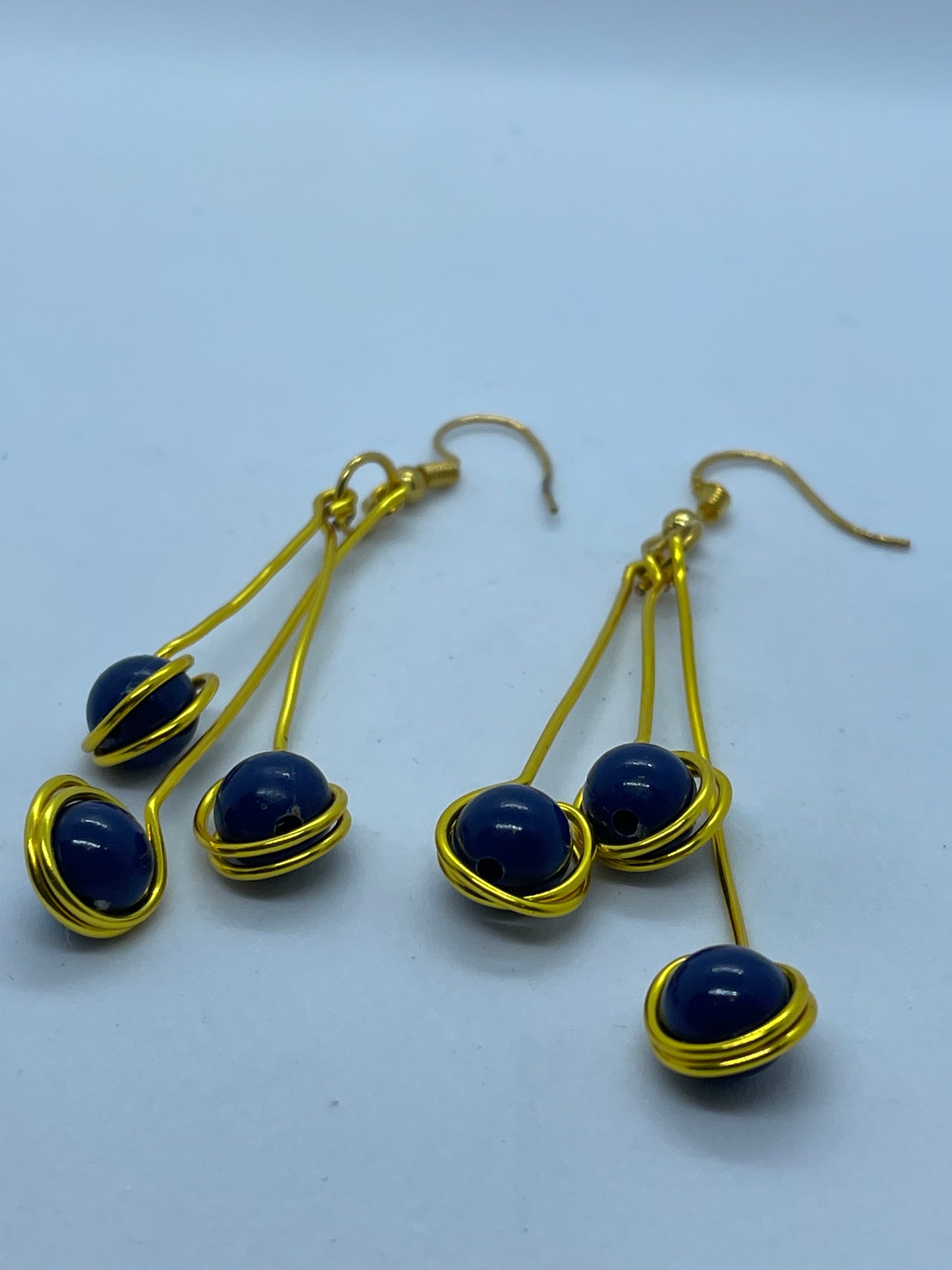 Wire & 3 blue bead earrings on gold wire