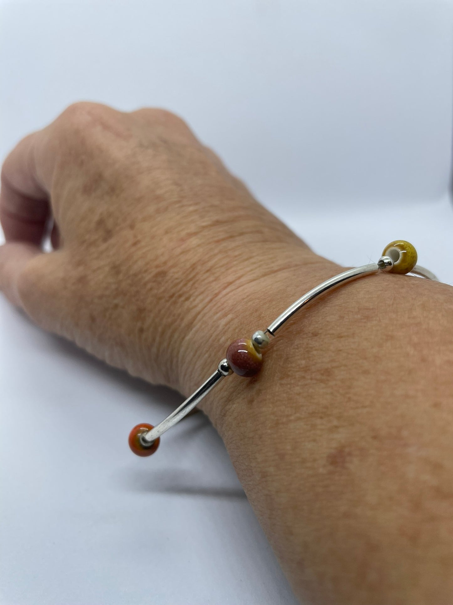 Wire & multi coloured bead bracelet